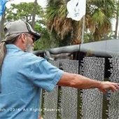 A man pointing toward the traveling vietnam memorial