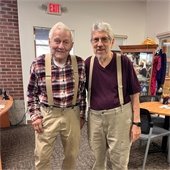 Two senior center members smiling together at the Center
