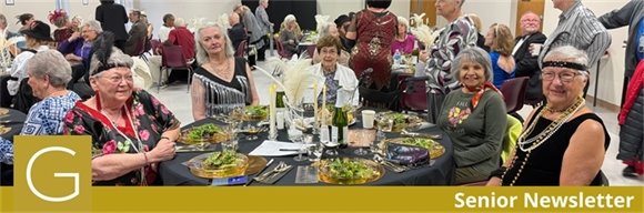 A table of senior center members dressed up for the murder mystery dinner