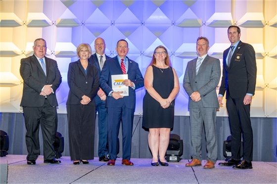 Gahanna staff receiving their CALEA award at the CALEA banquet.