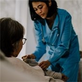 A photo of a nurse taking a patients blood pressure