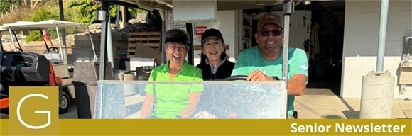 three people in a golf cart at the senior golf league fall event
