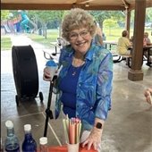 A senior center member smiling with a snow cone