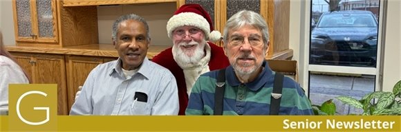 Two senior center members smiling with Santa during the Holiday Brunch