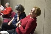 Two ladies at the senior center laughing together