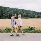 Two senior citizens on a walk outdoors