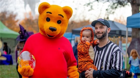 Three people at the Gahanna Goblin Fest dressed in Halloween costumes.