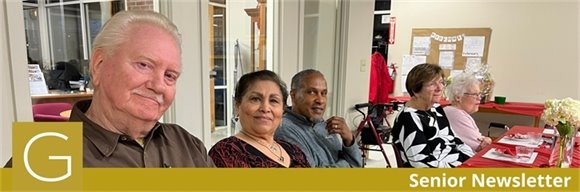 A group of Senior Center members sitting together at a table