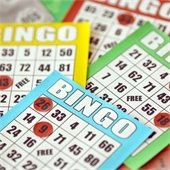 A table full of blank bingo cards
