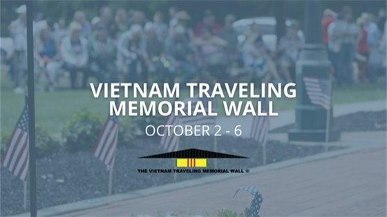 A photo of Veteran's Memorial Park with text "Vietnam Traveling Memorial Wall"