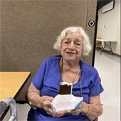 a senior center member enjoying an ice cream sandwich