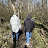 Two senior center members on a walk outside in the winter