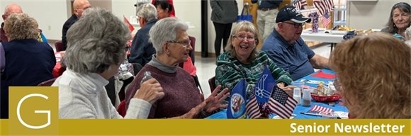 A table full of senior center members in good conversation during the veterans day breakfast