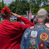 A photo looking onto a crowd for a Veterans Day Ceremony from behind.