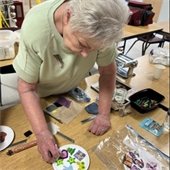 Gahanna senior center member making jewelry