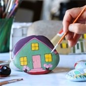 Rock being painted with several colors