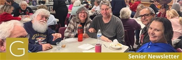 A room full of senior center members smiling at the Souper Bowl