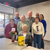 A group of senior center members celebrating a birthday