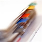 Close up image of a binder with tabs on the pages