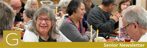 Senior Center members having conversations and smiling together at the Thanksgiving Meal