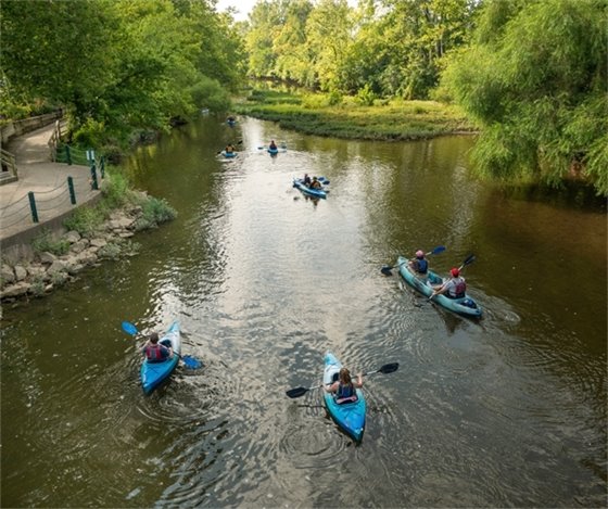 Image of a group of kayakers floating together