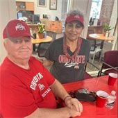 A couple at the senior center dressed in Buckeye gear