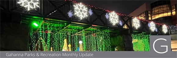 The Creekside bridge decorated with holiday lights and snowflakes