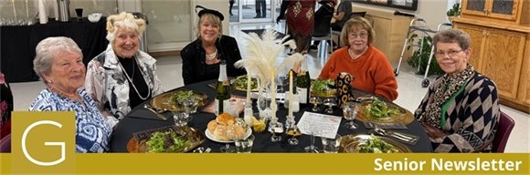 A group of senior center members sitting together at the Murder Mystery Dinner