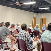 room full of senior center members listening to a presentation