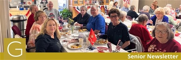 A table full of senior center members sharing a meal together for 2024 Veterans Day